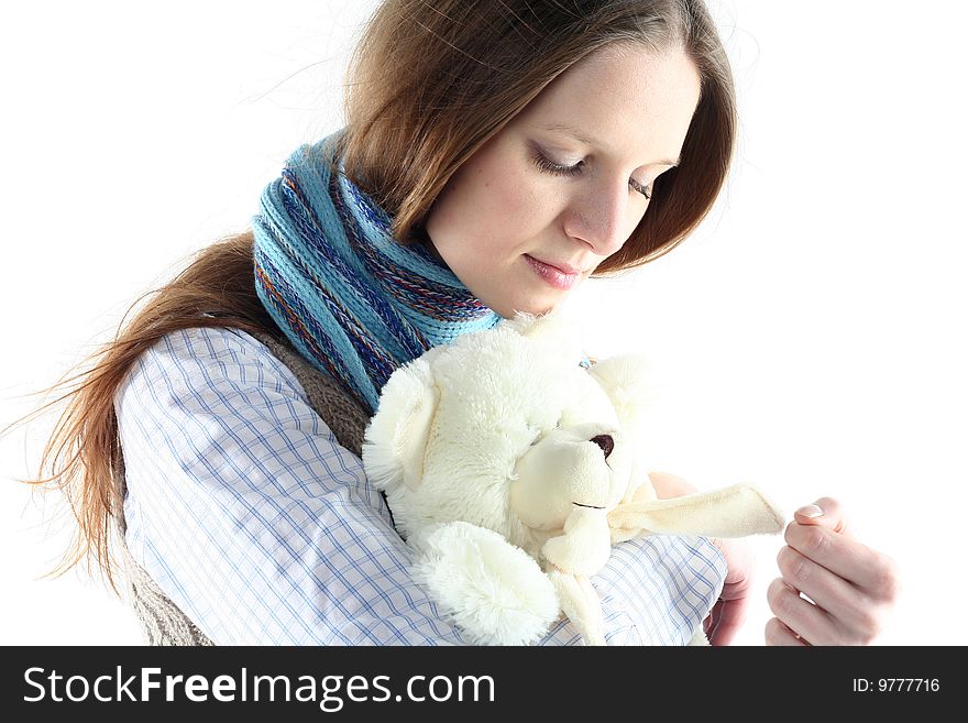 Portrait of young woman with teddy bear isolated on white background