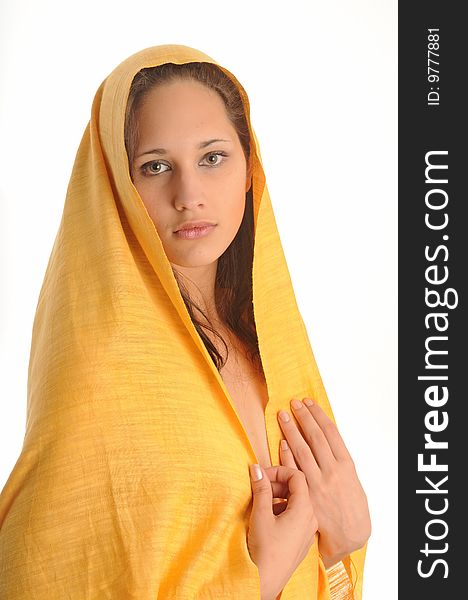 Pretty young woman  posing, wearing a yellow cloth