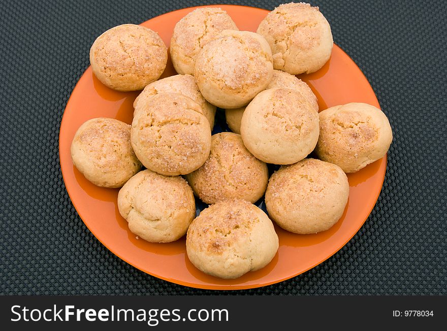 Sweet pastries on the orange plate