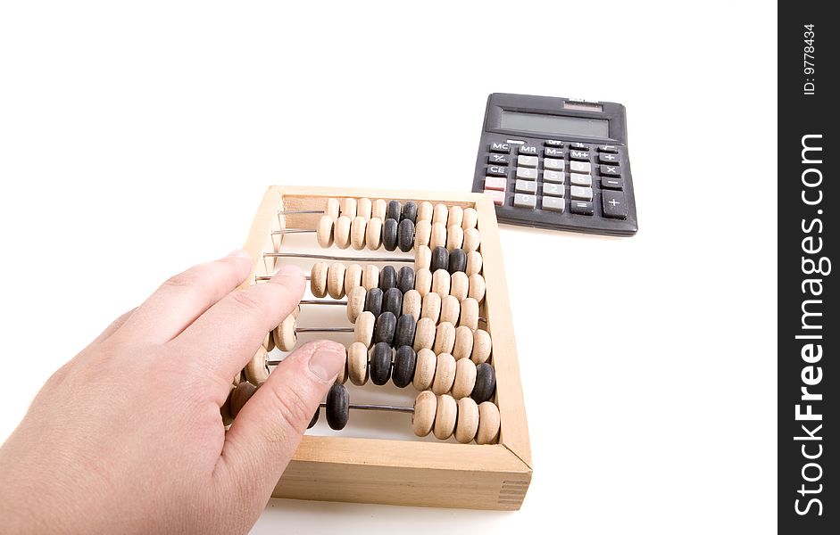 Abacus and calculator on white ground. Abacus and calculator on white ground