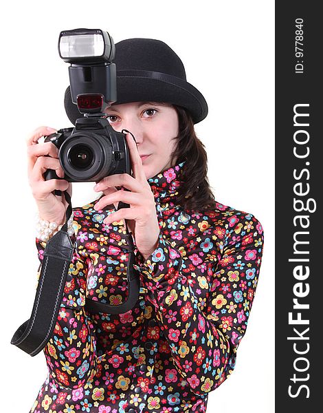 The nice girl holds the camera in hands. The nice girl holds the camera in hands