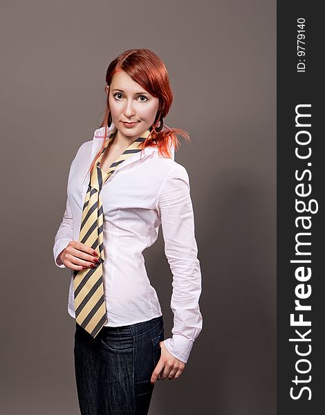 Red haired girl with tie separated