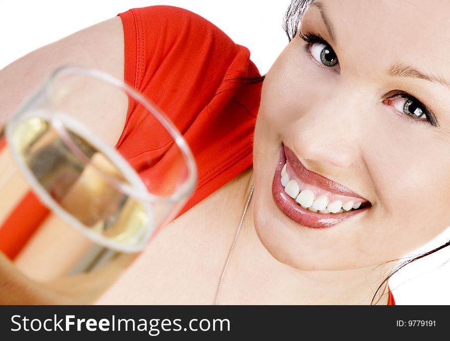 Happy brunette with a glass of champagne isolated on white