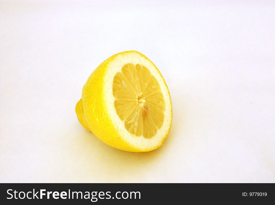 Lemon cut in half on a white background. Lemon cut in half on a white background
