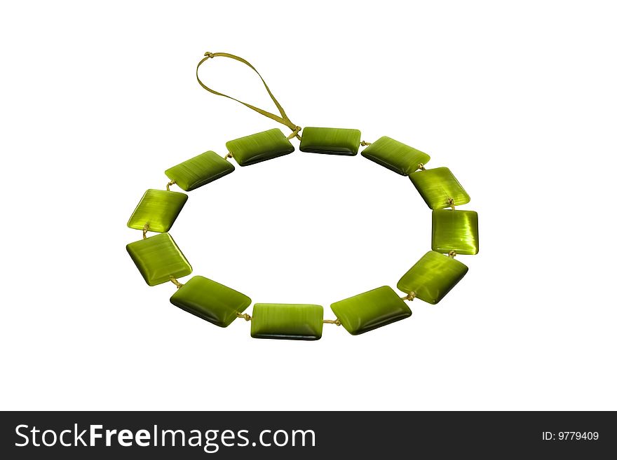 Beads, necklace from cat's eye green on a white background