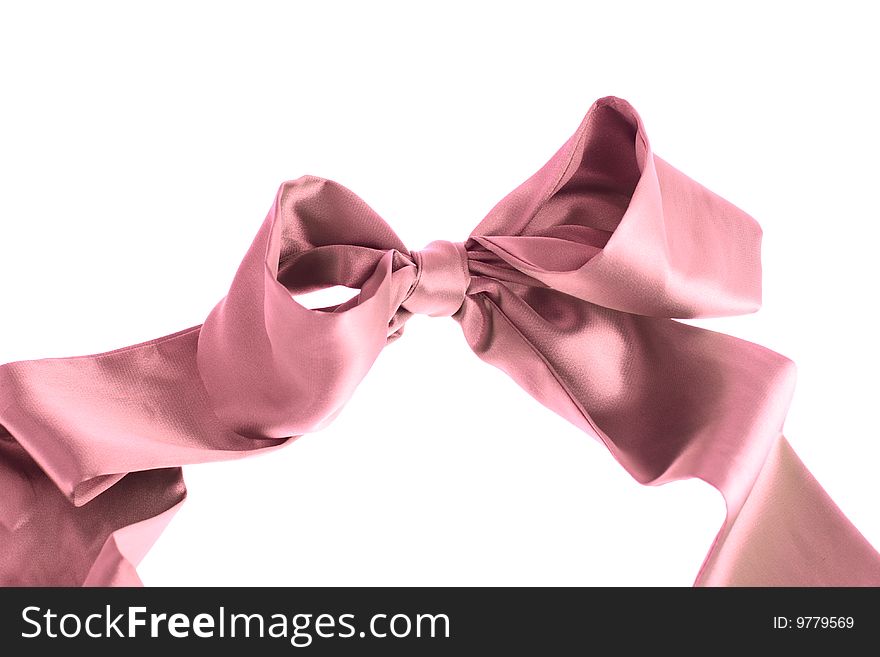 Decorated pink silky bow isolated over white background. Decorated pink silky bow isolated over white background