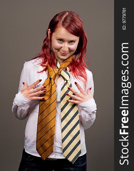 Smiling red haired woman with tie separated