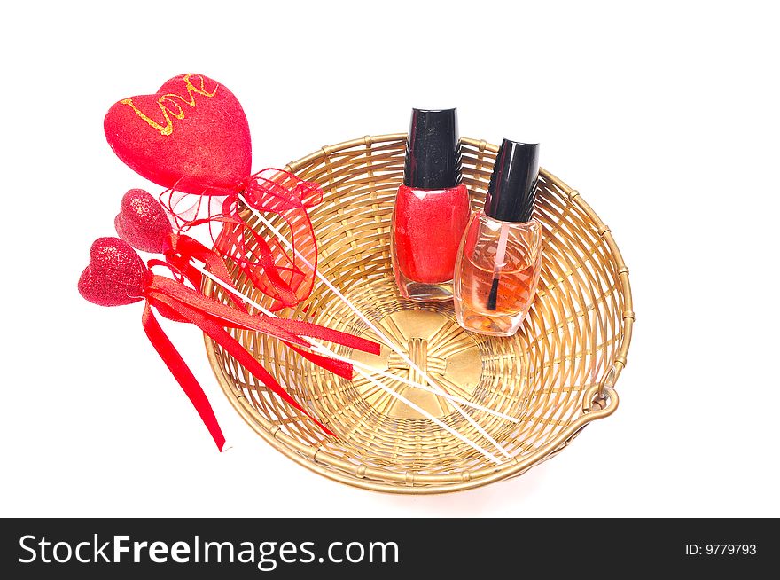 Nail paints in basket with hearts.