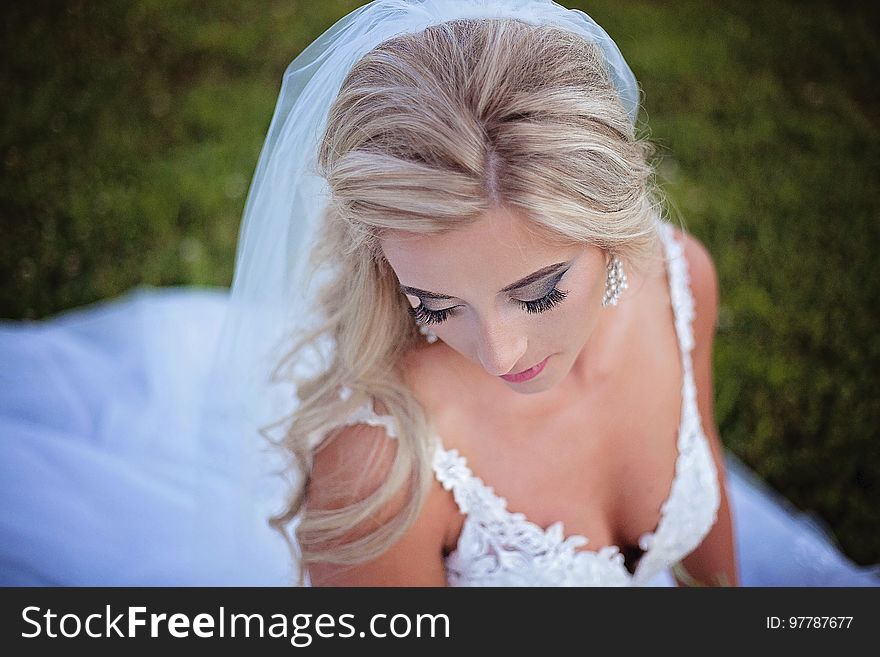 A portrait of a bride in white dress and veil. A portrait of a bride in white dress and veil.