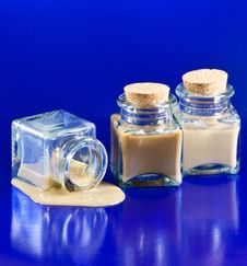 Three Bottles With Whiskey Liquor On The Floor Royalty Free Stock Photography Three Bottles With Whiskey Liquor On The Floor Royalty Free Stock Photography