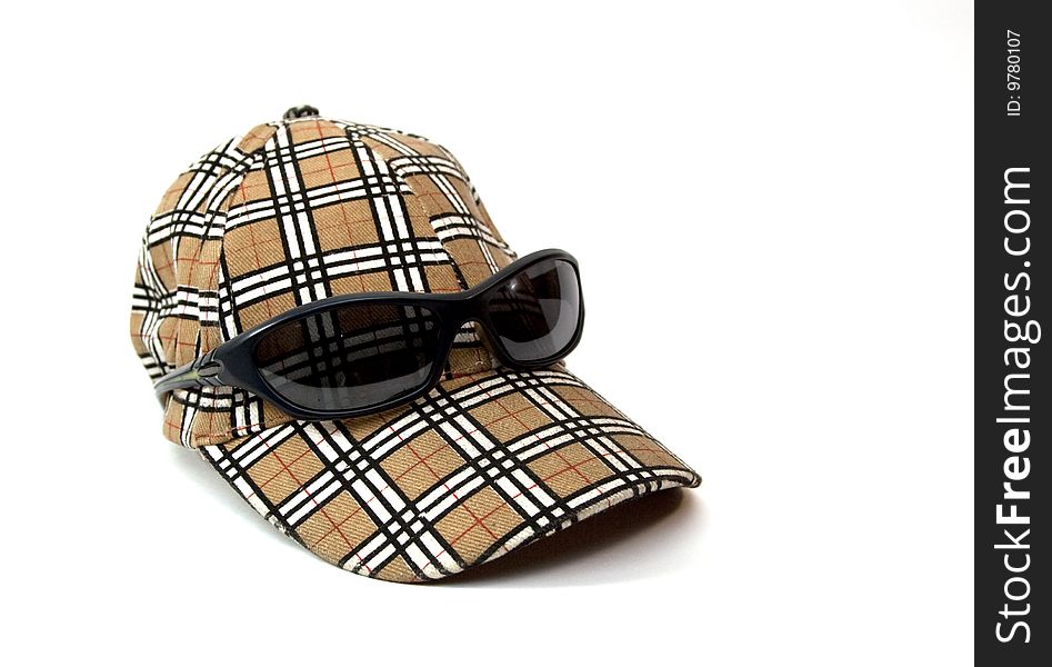 Sport cap isolated with sunglasses. Sport cap isolated with sunglasses