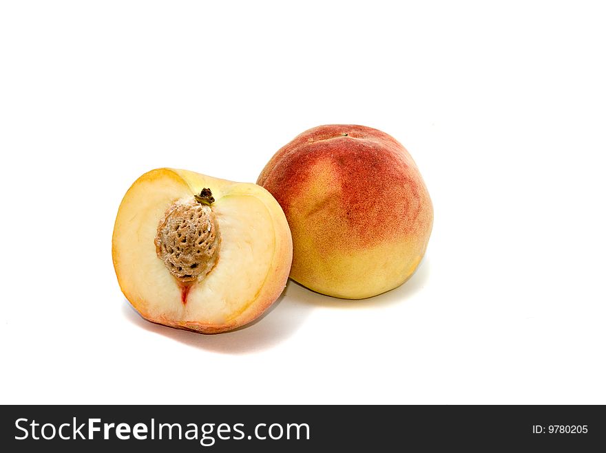 Peach and its section  isolated on white background