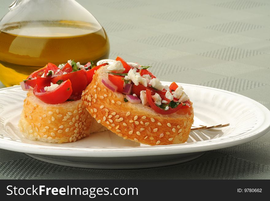 Delicious toasts topped with fresh tomatoes, onion, garlic and feta. Delicious toasts topped with fresh tomatoes, onion, garlic and feta.