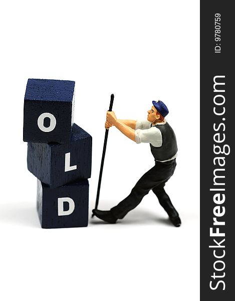 A workman tearing down the word old. A workman tearing down the word old