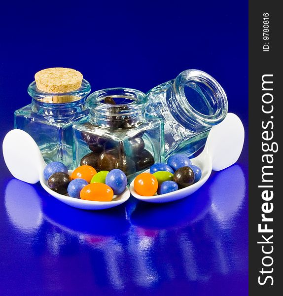 Crystal Bottles And White Spoons With Chocolate