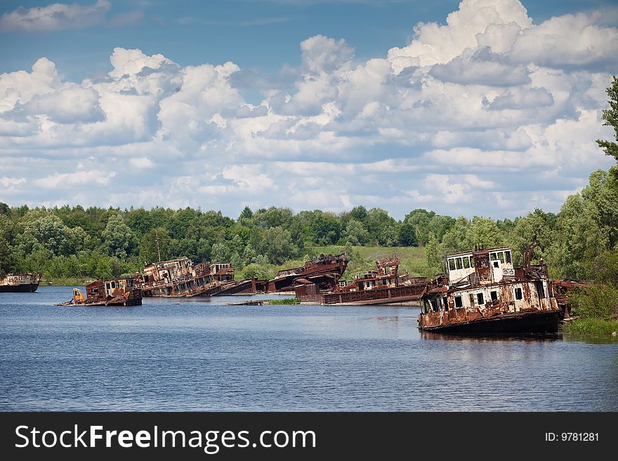 Old rusty ships in the river near of Chernobyl. Old rusty ships in the river near of Chernobyl