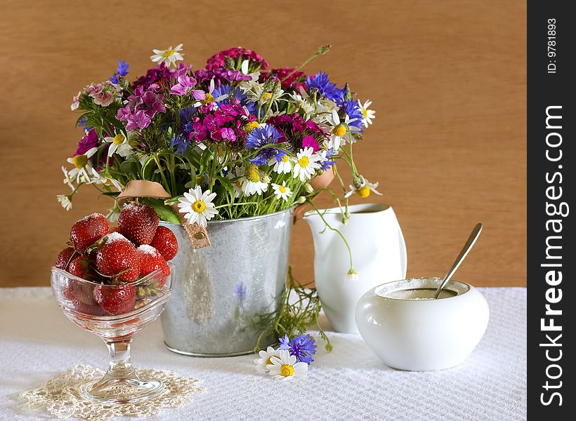 Still life with strawberries and wild flowers