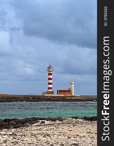 The lighthouse Faro de Toston, Fuerteventura. The lighthouse Faro de Toston, Fuerteventura.