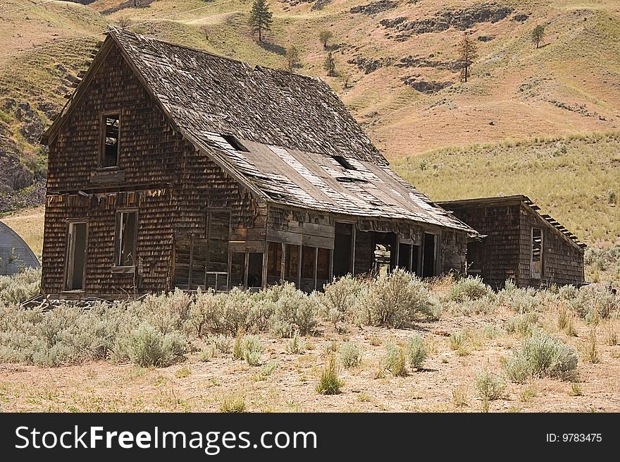 This is an old, ancient abandoned homestead building set in the arid mountains of Washington state. This is an old, ancient abandoned homestead building set in the arid mountains of Washington state.