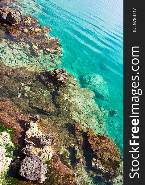 Rocks under a transparent sea water