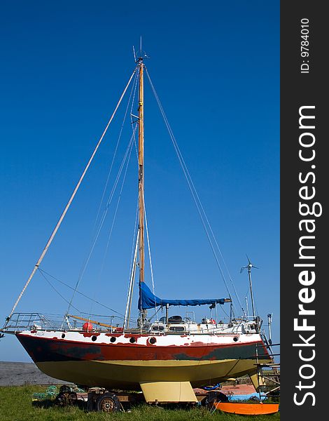 Sailing boat being repaired on the Holy Island of Lindisfarne