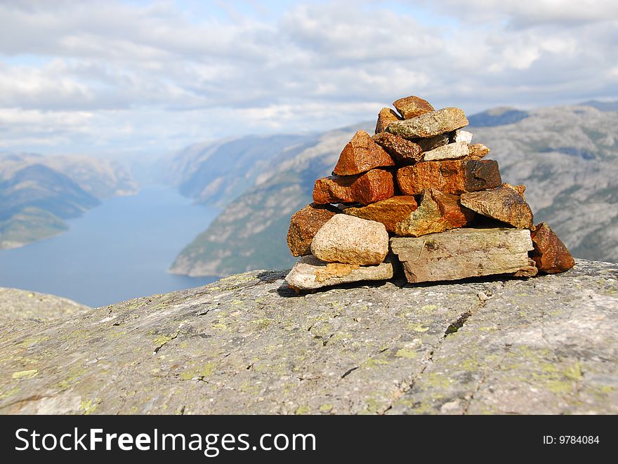 Small building made of stones - In background sea and clouds. Small building made of stones - In background sea and clouds