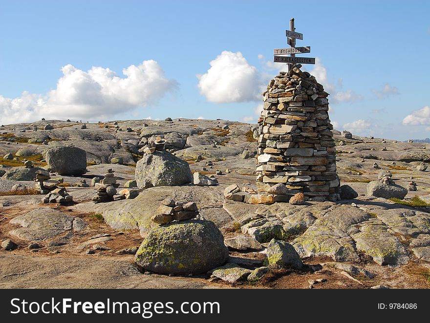 Small building made of stones - In background clouds. Small building made of stones - In background clouds