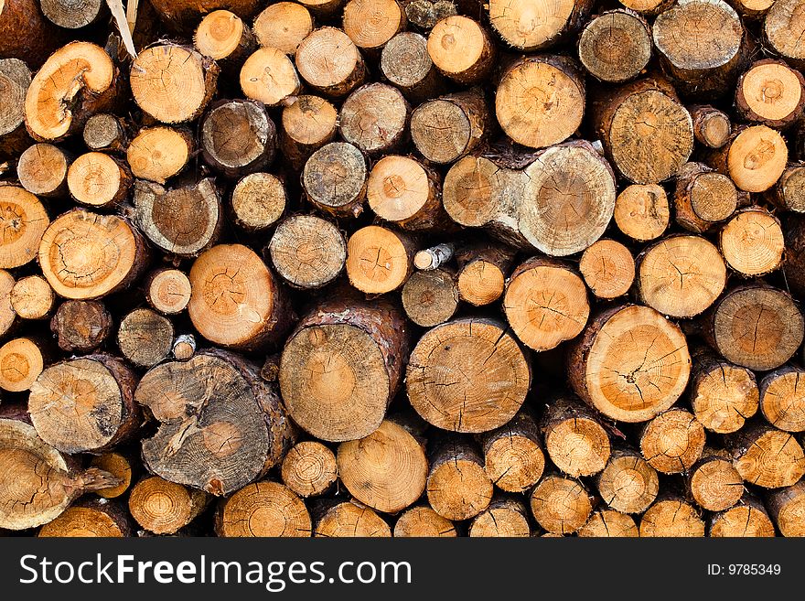 Woodstack background. A lot of pieces firewoods. Woodstack background. A lot of pieces firewoods.