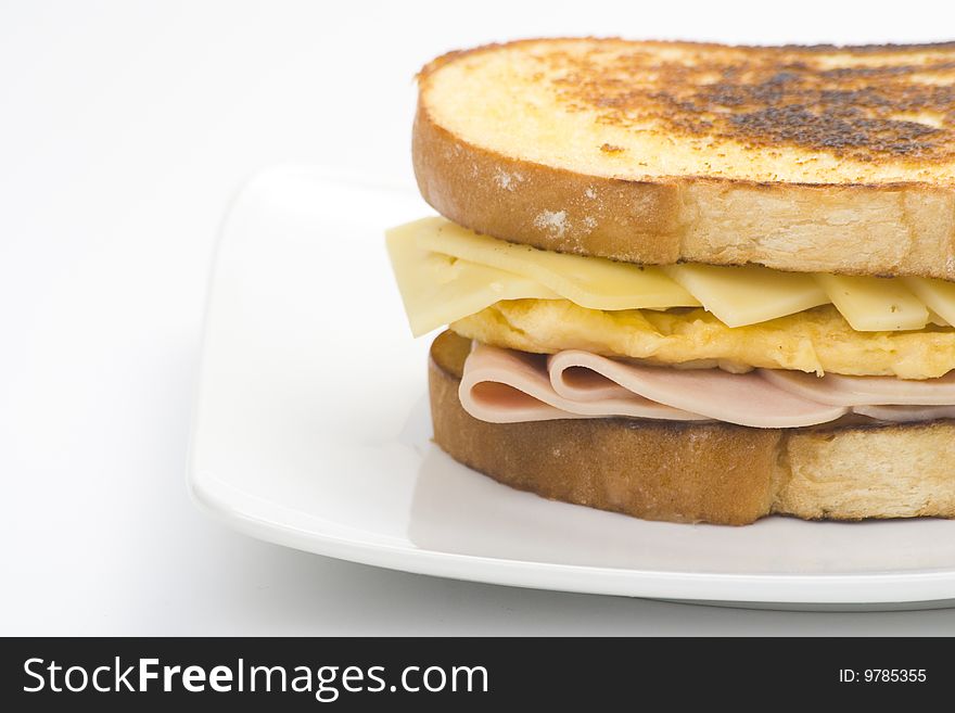 Tasty sandwich of ham and cheese omelet isolated