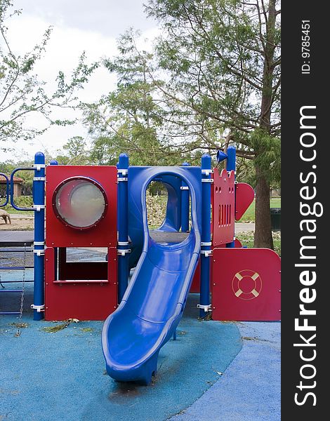 A playground with slides shaped into a boat