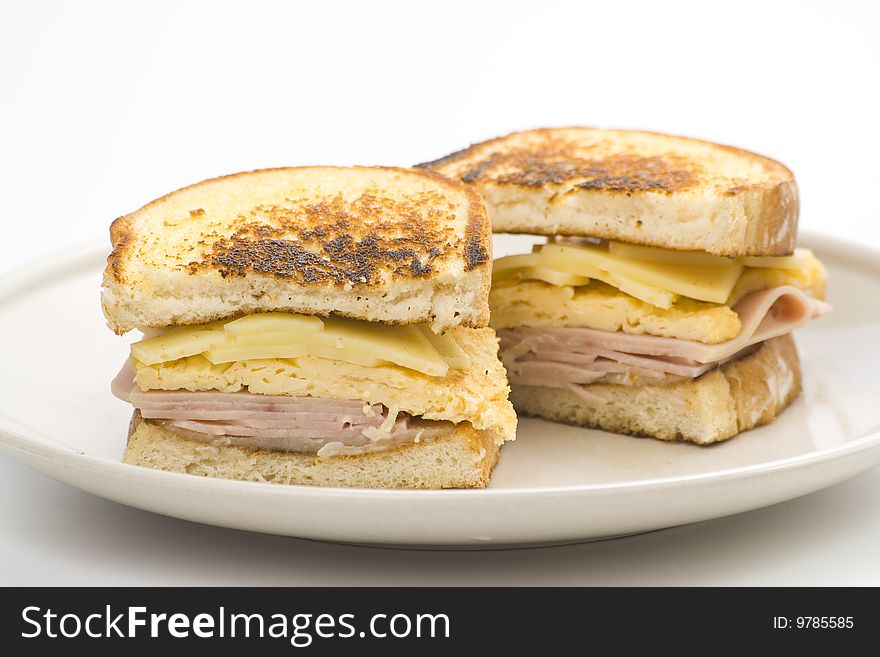 Tasty sandwich of ham and cheese omelet isolated