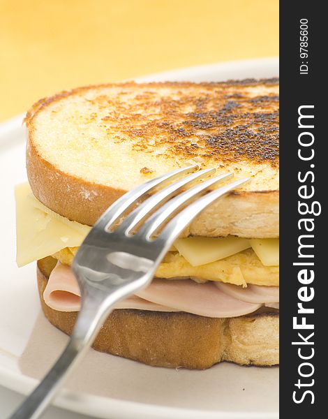 Tasty sandwich of ham and cheese omelet isolated