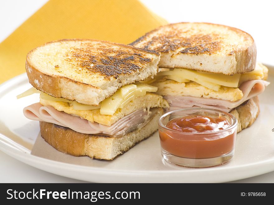 Tasty sandwich of ham and cheese omelet isolated