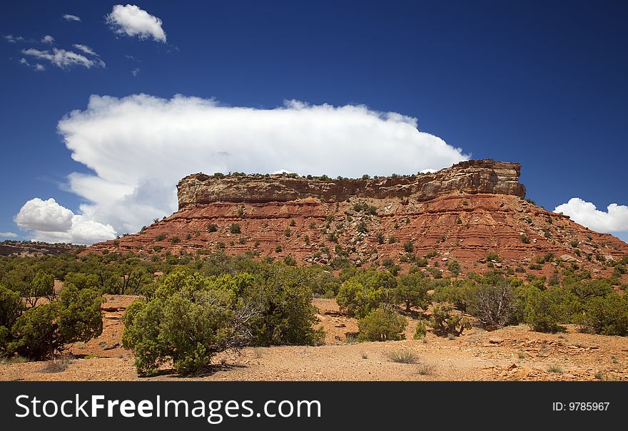 View of red rock formations in San Rafael Swell with blue sky�s the and clouds