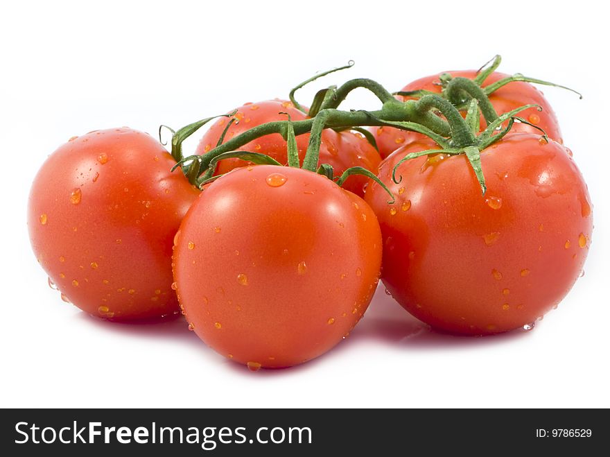 Fresh red tomatoes isolated on a white background