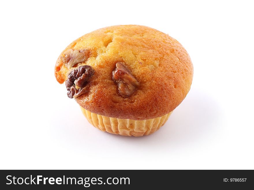A vanilla muffin with almond nuts isolated on white background. A vanilla muffin with almond nuts isolated on white background.
