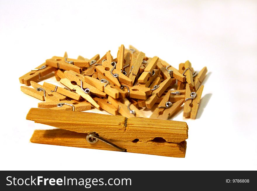Bunch of little clothes pins with one larger parent or teacher clothes pin