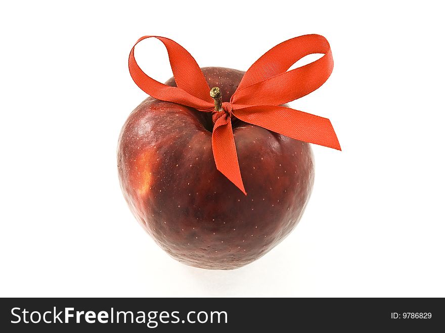 Apple with red bow isolated on white