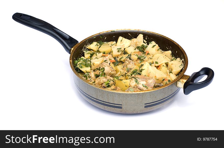 Food: the Potato on house with a hen on a frying pan
