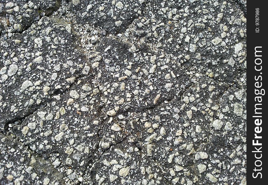 A top view of cracked asphalt cement. A top view of cracked asphalt cement.