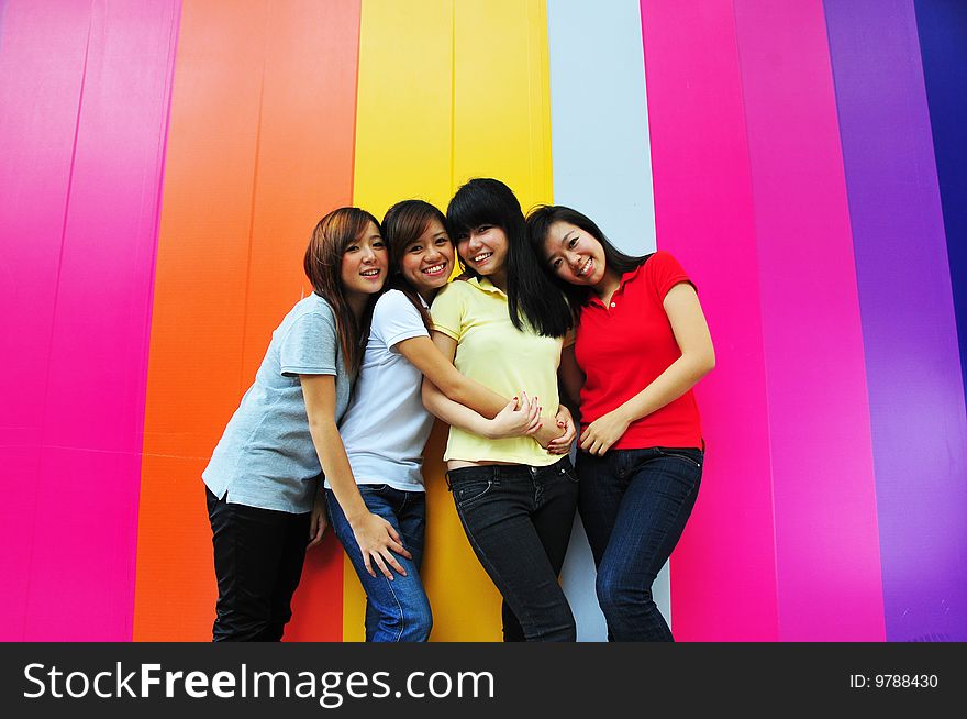 Beautiful Young Women Having Fun With Colourful Background. Beautiful Young Women Having Fun With Colourful Background.