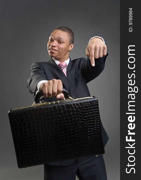 Businessman offers briefcase