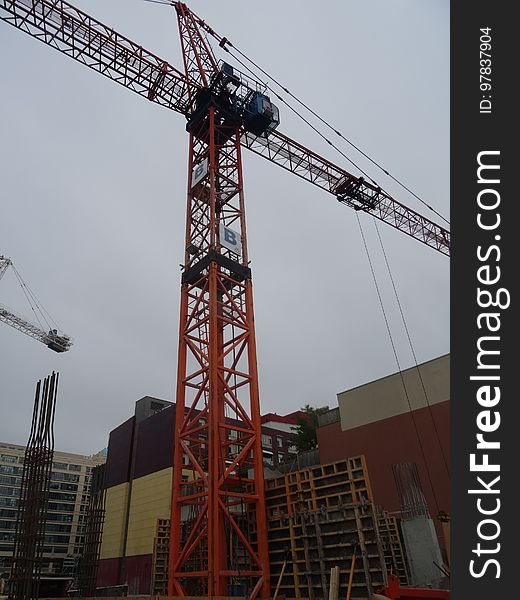A homeless guy climbed this crane, at Jarvis and Dundas, on 2017-08-02, to protest building luxury condos, not affordable homes -a