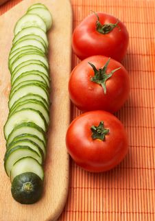 Red-ripe Tomatoes And Slices Of Cucumber Royalty Free Stock Photo Red-ripe Tomatoes And Slices Of Cucumber Royalty Free Stock Photo