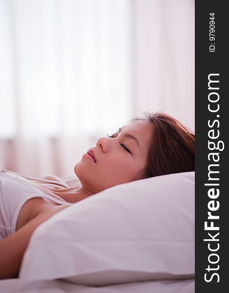 An image of an asian girl sleeping. An image of an asian girl sleeping