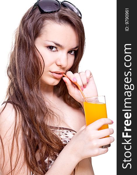 Beautiful women in swimsuit with a glass of juice on a white background isolated