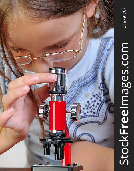 Girl Studying Something With Microscope