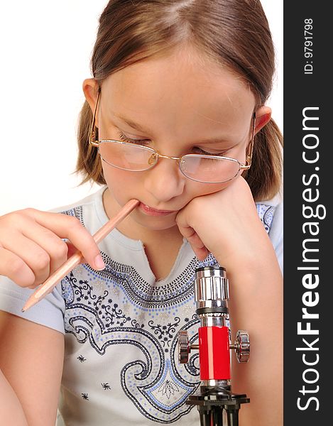 Girl studying something with microscope