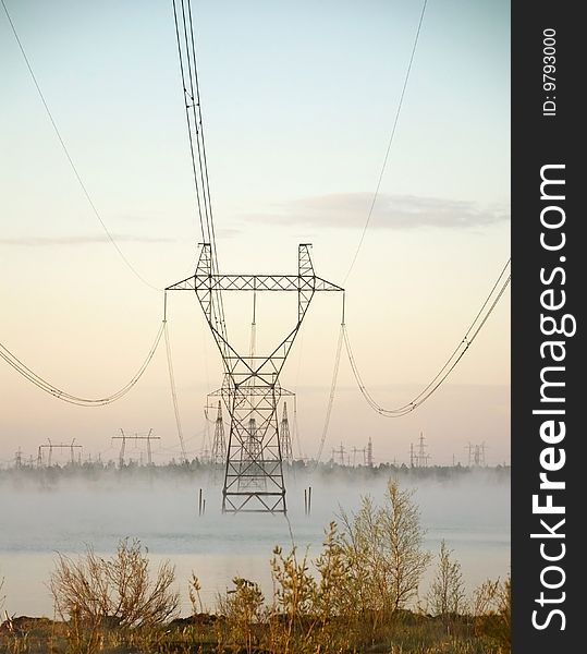 High-voltage post on a background blue sky