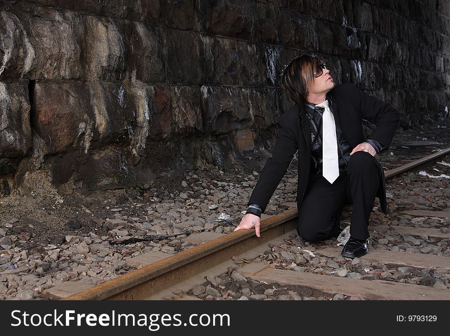 Handsome young man wearing a suit, outdoors fashion. Handsome young man wearing a suit, outdoors fashion